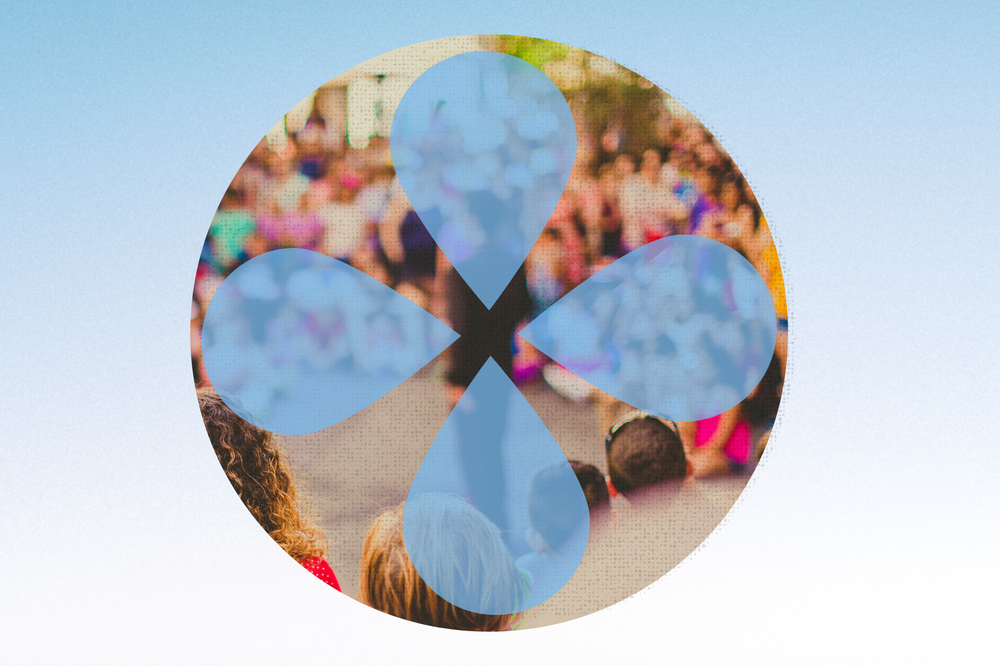 A circular image of a crowd of people is placed over a light blue gradient background. Four translucent light blue droplet shapes are superimposed over the image.