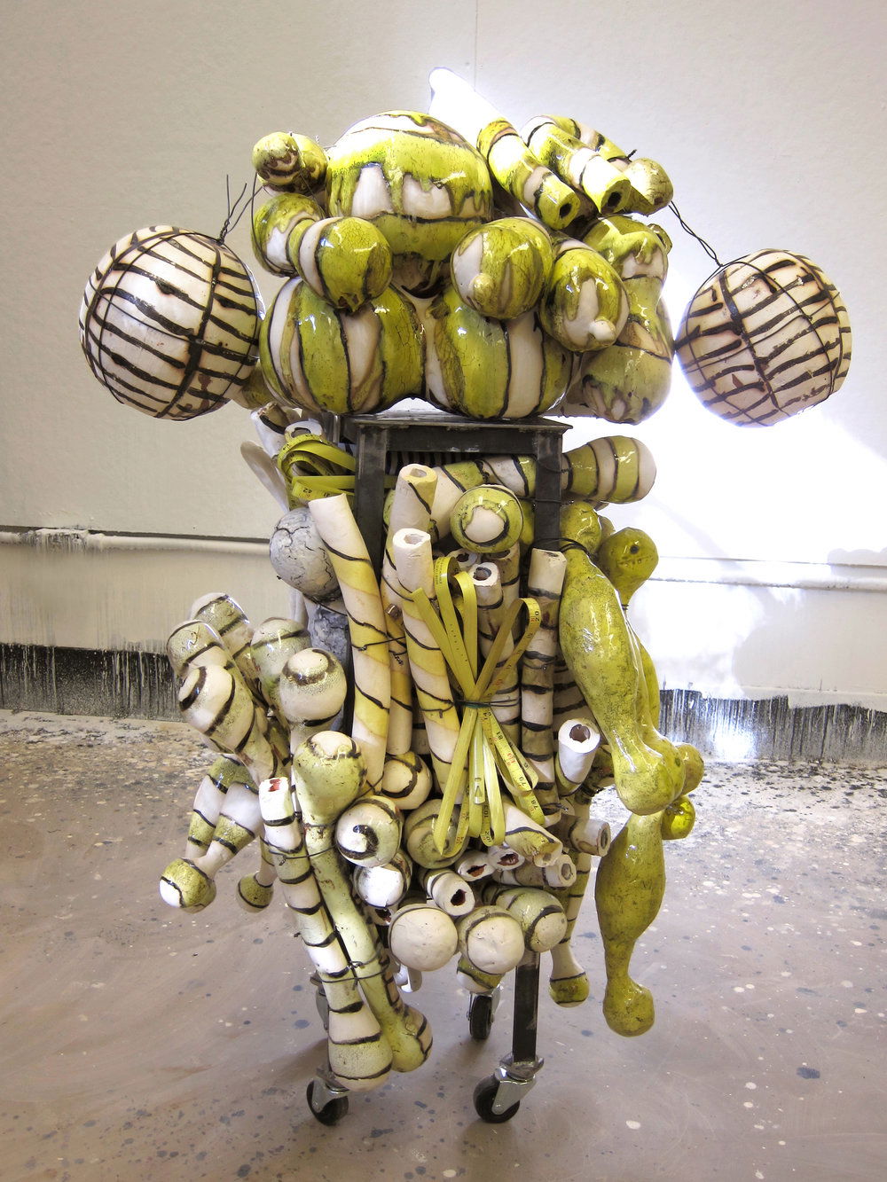 “ROOL”, 2011. Fired ceramic, steel baling wire, steel base, 2” casters. Photo courtesy of the artist.