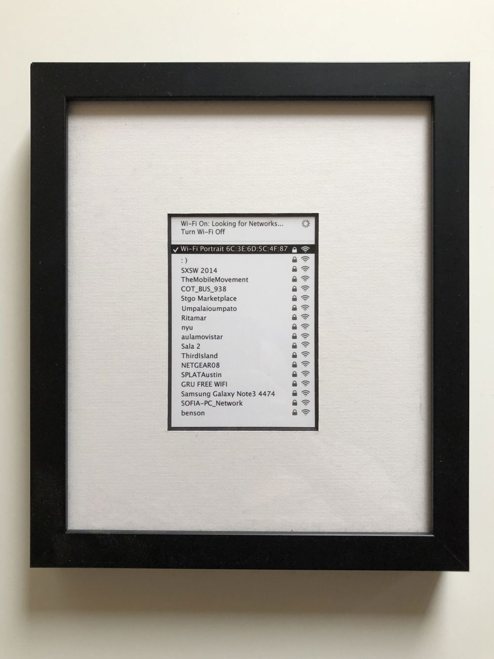 <em>From The Dark</em>, 2015. Framed print; collection of Wi-Fi networks stored in the memory of a smart phone captured as the phone attempted to connect to Wi-Fi in a public space. New York City, NY.