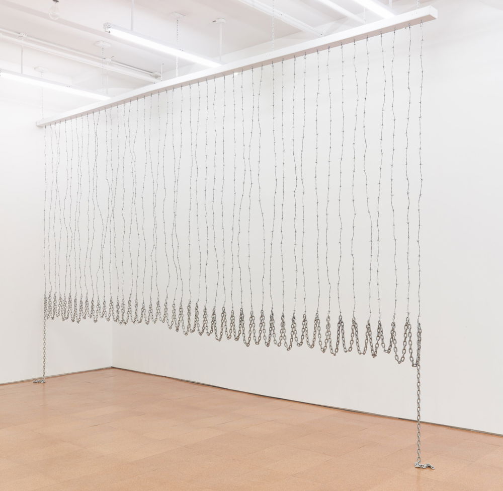 <em>Curtain for William and Peter</em>, 1969/2012. Barbed wire and chain, dimensions 138.5 x 220 inches.