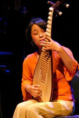 Photo of Wu Man in performance.