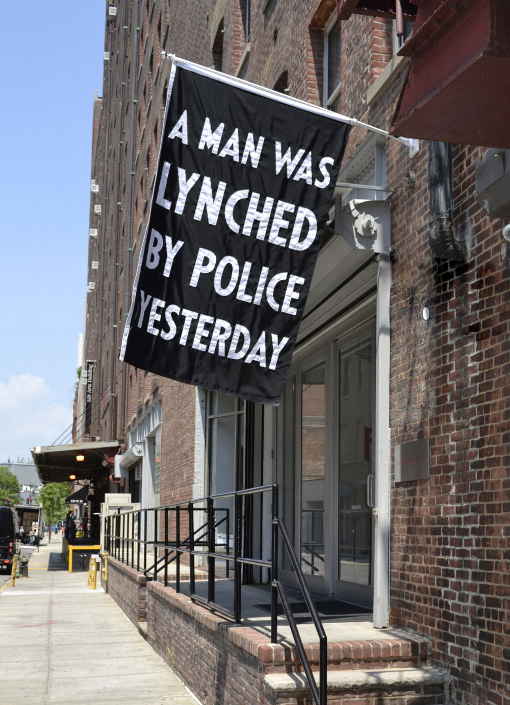A Man Was Lynched By Police Yesterday, nylon, 84 x 52-1/2 inches, 2015. Based on NAACP banner; installed at Jack Shainman gallery in July 2016. Photo courtesy of the artist and Jack Shainman Gallery, New York.
