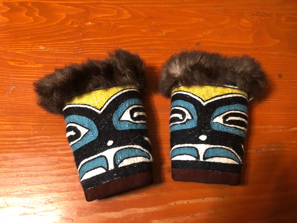 <em>Yanwaashaa Power Cuffs</em>, 2018. Merino Sheep wool trimmed with leather and sea otter fur, dimensions 7.5 inches circumference at wrist and 11 inches at wide end.