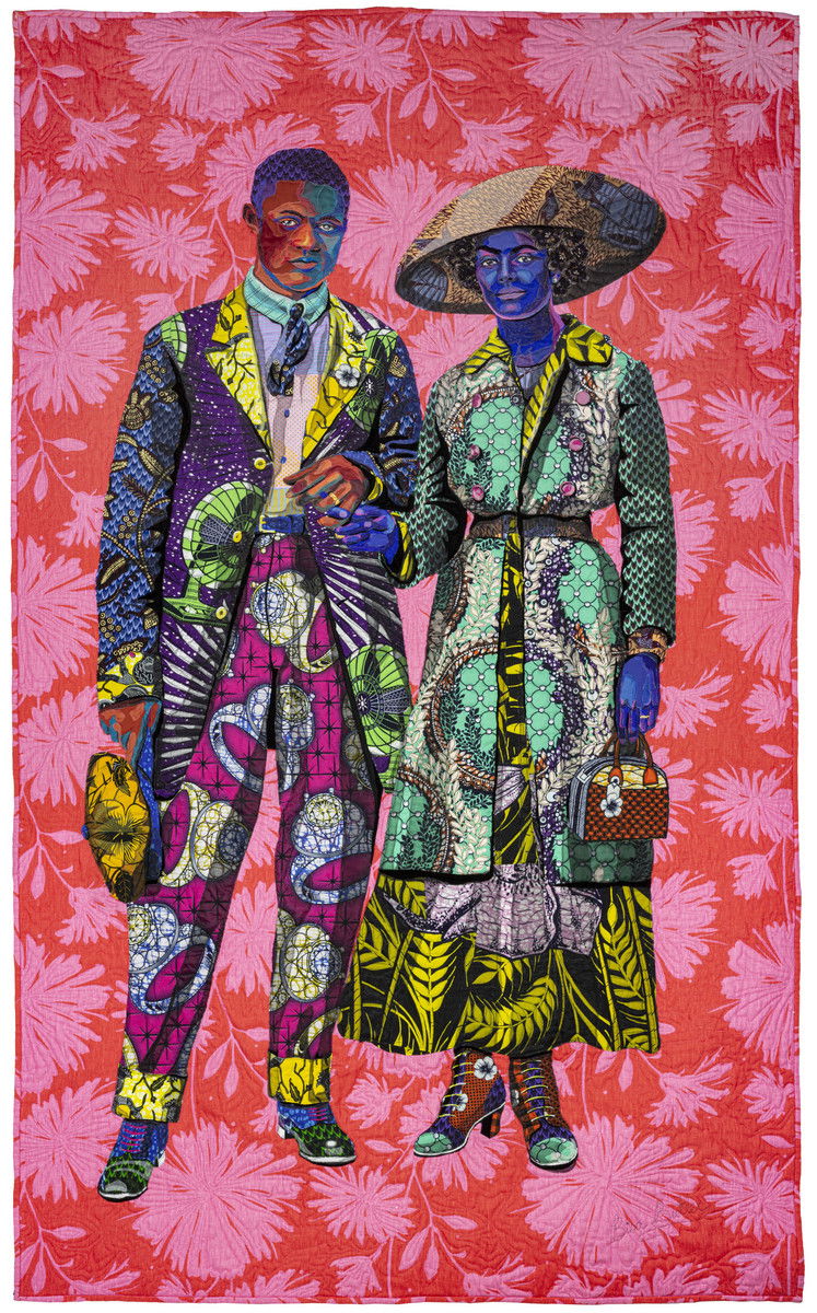 A 1930s African American couple poses against a red and pink floral patterned background. Their attire is an array of vibrant clashing pink, yellow, teal, purple, orange, and blue patterns. The man wears a suit and holds a newsboy cap. His magenta pants have a print of giant diamond rings and his skin is depicted with red and teal. The woman wears a black sleeved dress with a big yellow leaf pattern, wide brim hat, and holds a handbag. Her skin is depicted with blue and purple.
