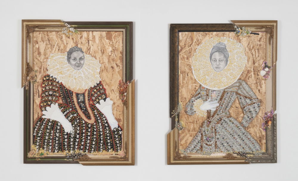 Two portraits on plywood hang next to one another in fragmented, ornate frames. Both feature women dressed in the style of nobility in the Renaissance, including lavish lace collars.
