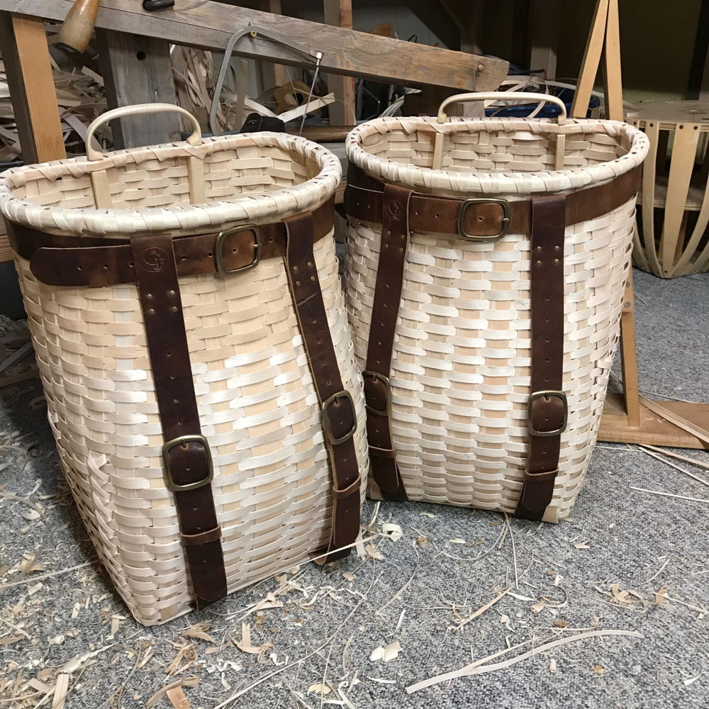 Traditional Passamaquoddy black ash pack baskets. Black ash, leather straps.