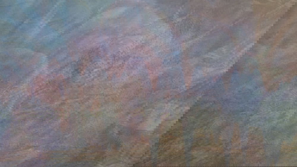 Colorful semi-transparent abstract shapes are layered on top of each other.
